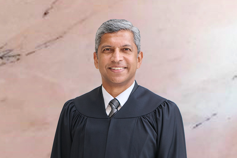 Justice Hri Kumar Nair with background